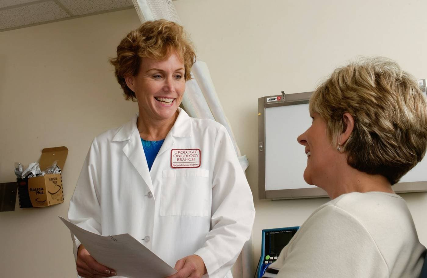 Healthcare professional speaking with a patient